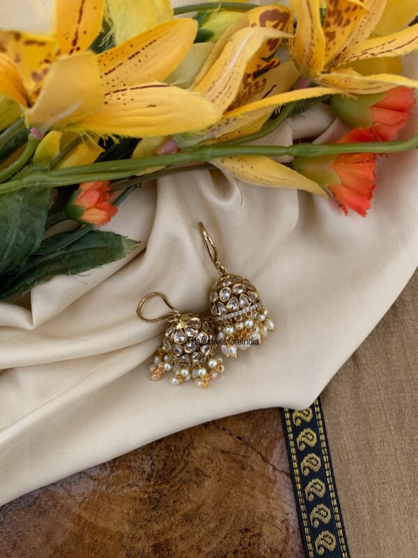 An all white hook jhumkas