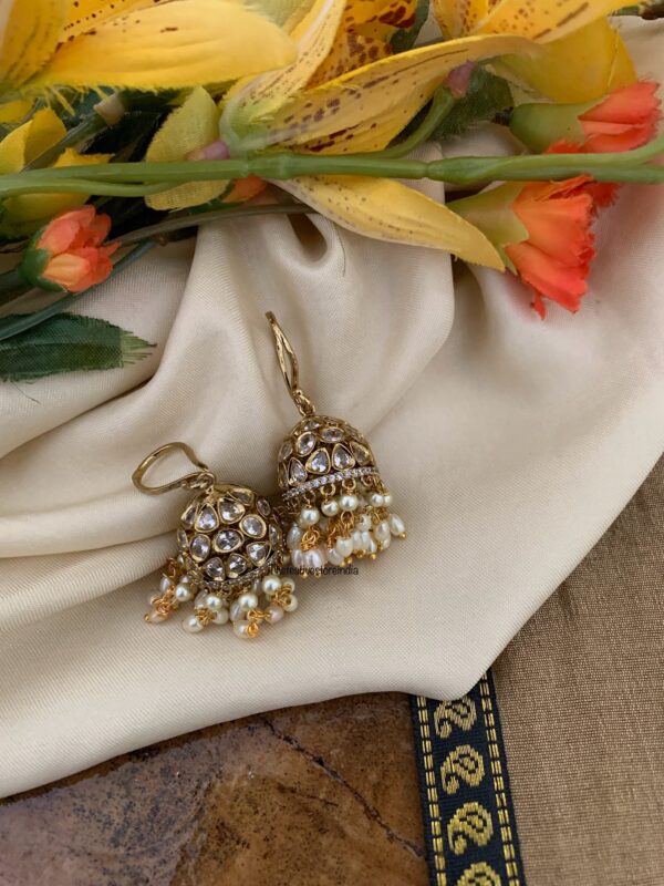 An all white hook jhumkas
