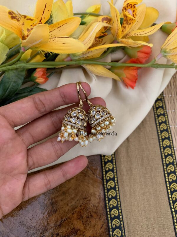 An all white hook jhumkas