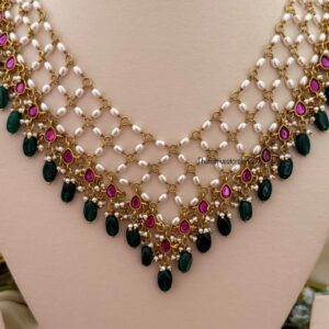 Close knit Jadau pearls with kemp stones green drop hanging chain