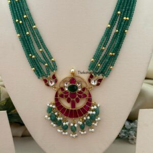 Mid length big Jadau pendant green haaram with screwback earrings