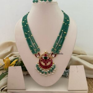 Mid length big Jadau pendant green haaram with screwback earrings
