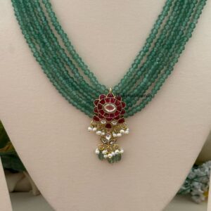 Classic Mid length Jadau pendant green haaram with screwback earrings
