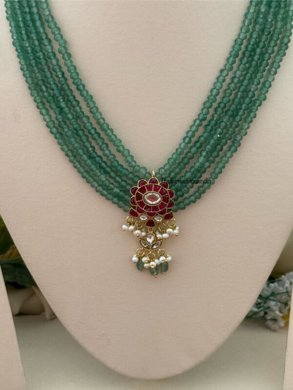 Classic Mid length Jadau pendant green haaram with screwback earrings