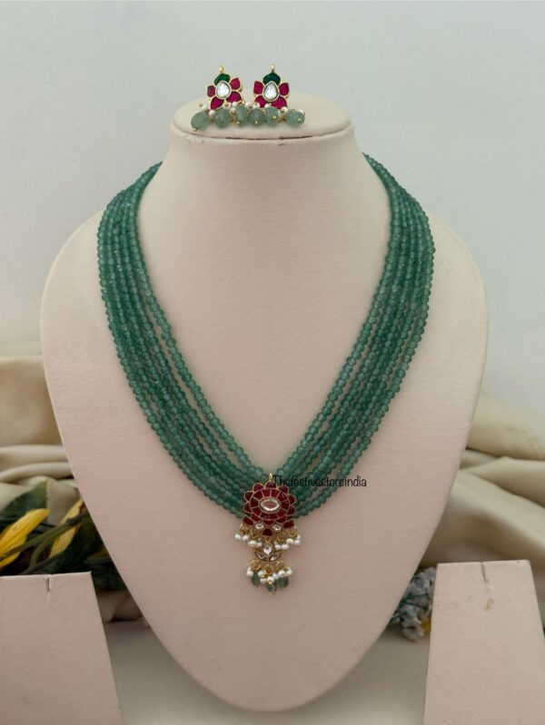 Classic Mid length Jadau pendant green haaram with screwback earrings