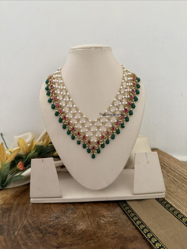 Close knit Jadau pearls with kemp stones green drop hanging chain | Unique