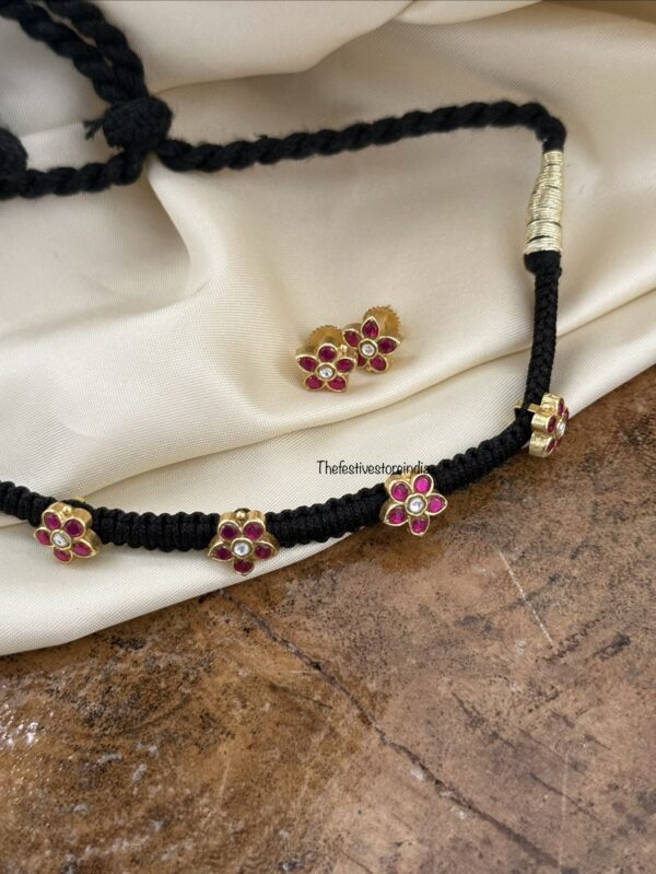 Jadau black thread floral motif chain with screwback matching earrings