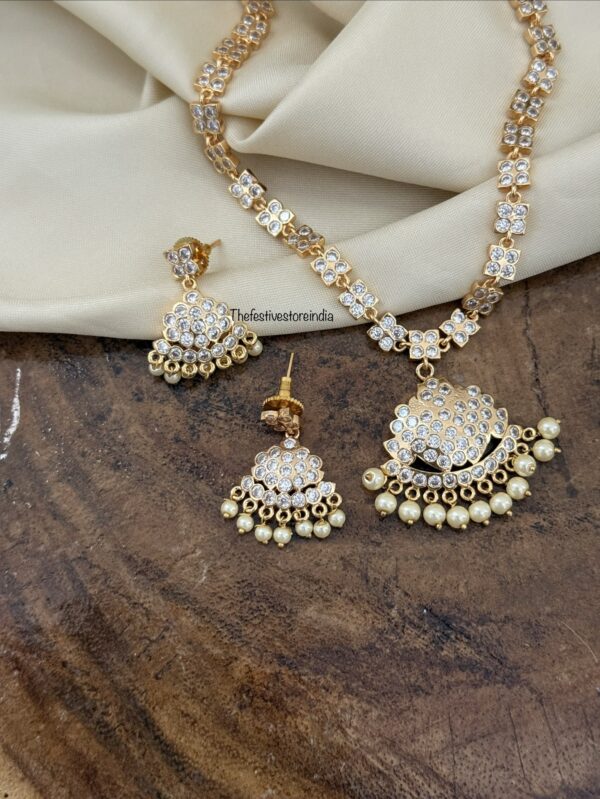 Gold look alike diamonds attigai set