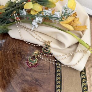 Gold look navilu earrings with attached maati