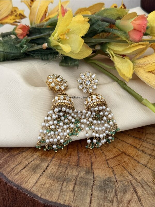 Floral jhumka with green asymmetric drop beads