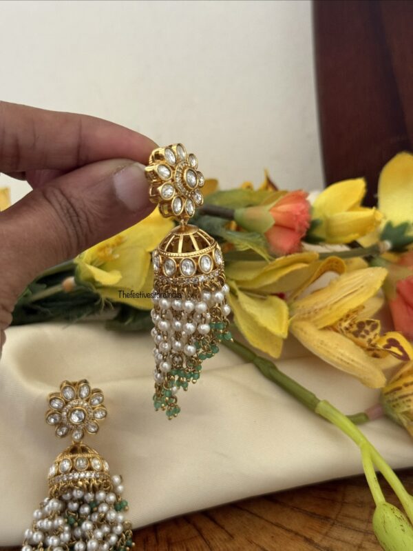 Floral jhumka with green asymmetric drop beads